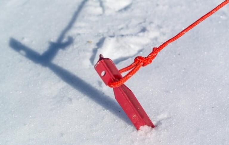 How To Stake Down A Tent Securely In Deep Snow?